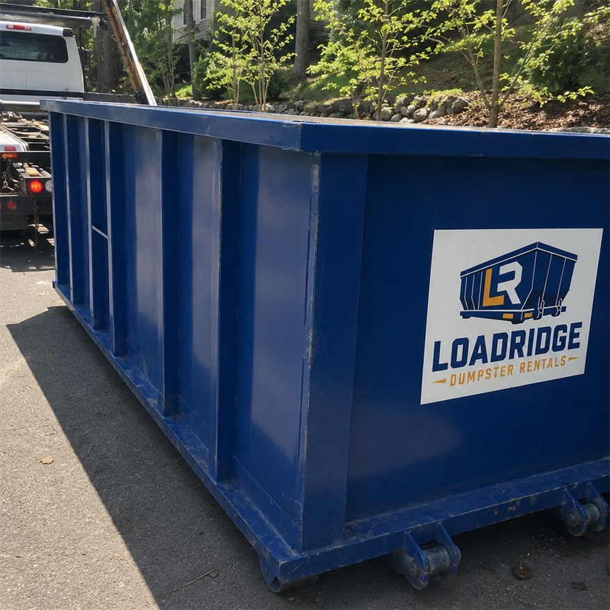 Blue Loadridge dumpster positioned for a cleanup project